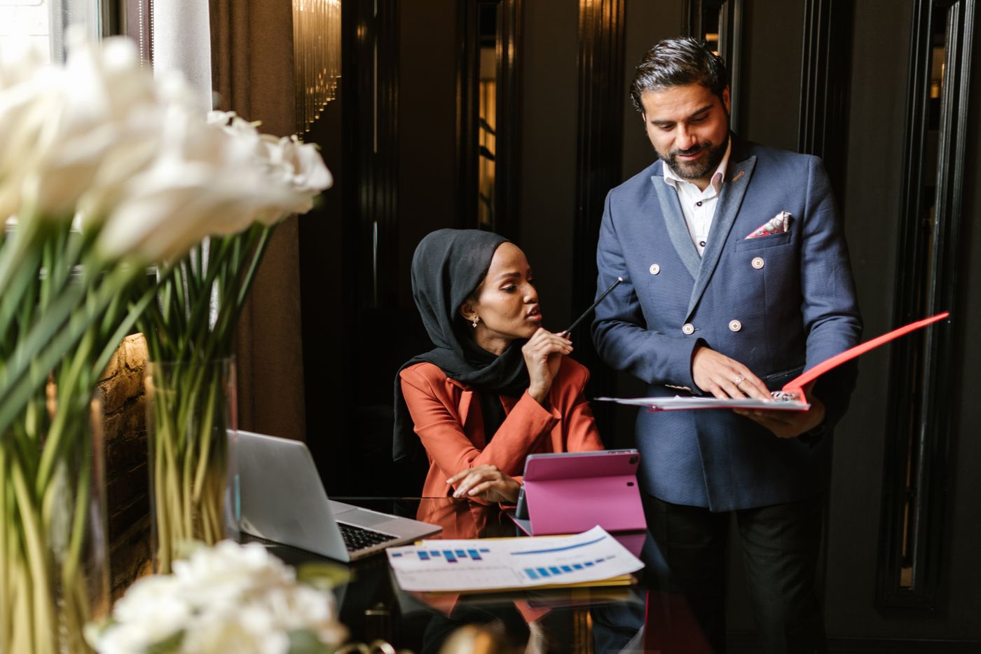 A manager going through a document with a colleague